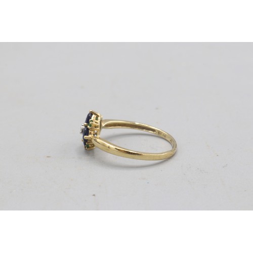 38 - Hallmarked 9ct yellow gold sapphire, emerald and diamond flower head cluster ring, comprised of a sm... 