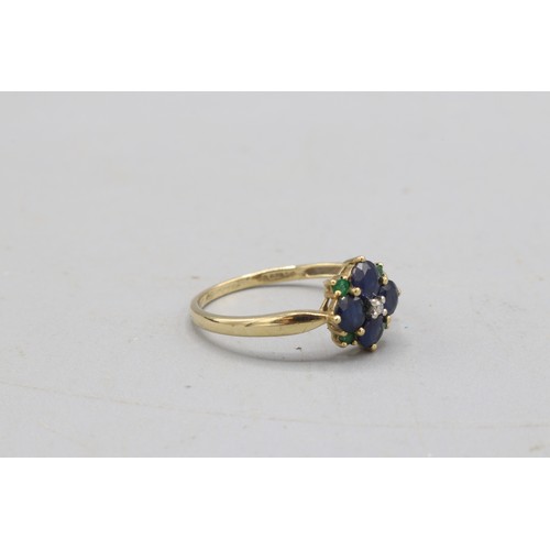 38 - Hallmarked 9ct yellow gold sapphire, emerald and diamond flower head cluster ring, comprised of a sm... 
