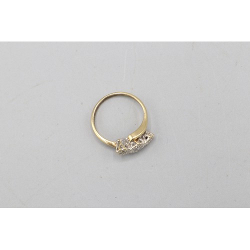 46 - Hallmarked 9ct yellow gold offset diamond trilogy ring, comprising one central round brilliant-cut d... 