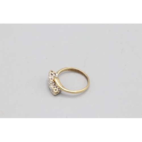 46 - Hallmarked 9ct yellow gold offset diamond trilogy ring, comprising one central round brilliant-cut d... 