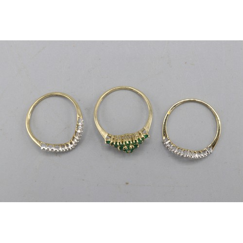 47 - Set of three hallmarked 9ct yellow gold rings, comprised of one diamond shaped head created emerald ... 