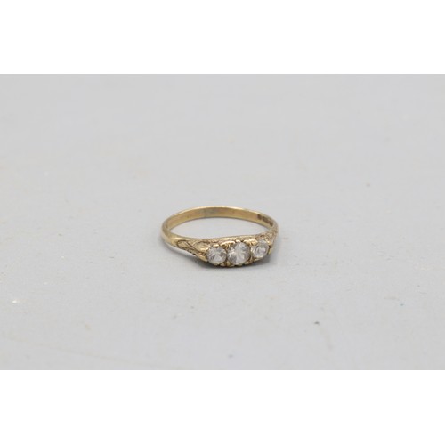 57 - Hallmarked 9ct yellow gold cubic zirconia boat head trilogy ring, comprised of three round brilliant... 