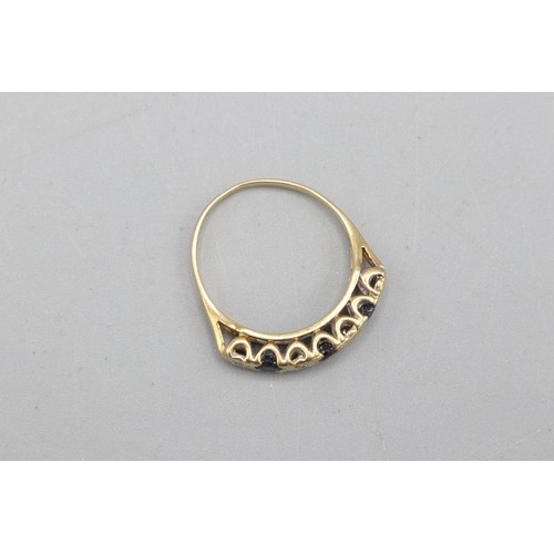 53 - Hallmarked 9ct yellow gold illusion-set diamond and sapphire eternity ring, comprising four round di... 