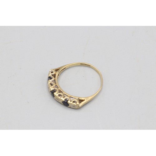 53 - Hallmarked 9ct yellow gold illusion-set diamond and sapphire eternity ring, comprising four round di... 