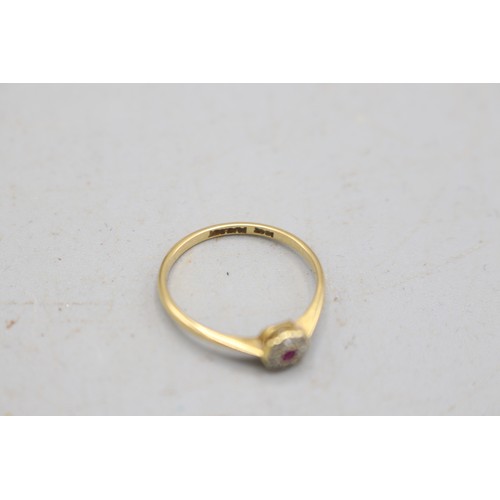 32 - 18ct yellow gold and platinum ruby and diamond halo ring, comprising a central ruby, approximately 0... 