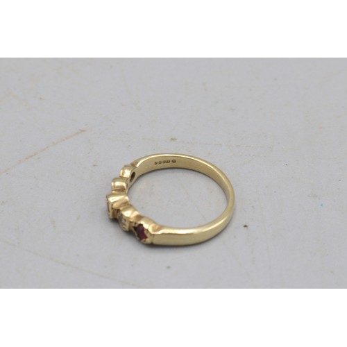 33 - Hallmarked 9ct yellow gold ruby and diamond half eternity ring, comprising three round cut rubies bi... 