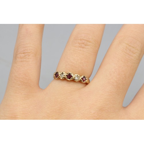33 - Hallmarked 9ct yellow gold ruby and diamond half eternity ring, comprising three round cut rubies bi... 