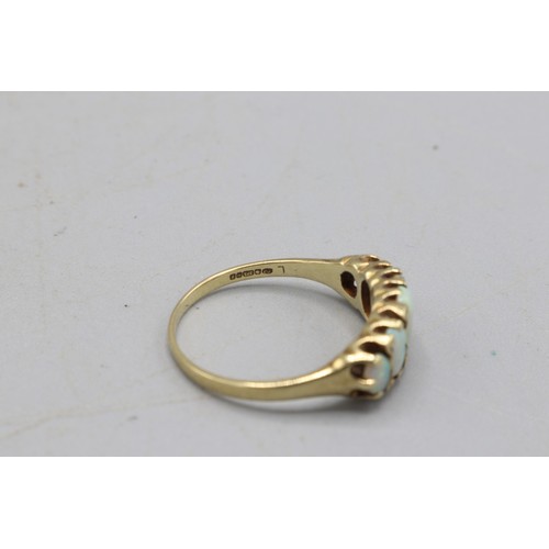 49 - Hallmarked 9ct yellow gold opal boat-head ring, comprising five graduating oval opals, one of which ... 
