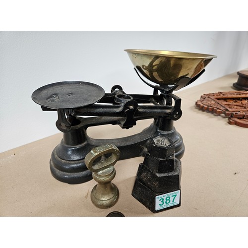 Set of weighing scales along with a set of 4 graduated scale weights ...