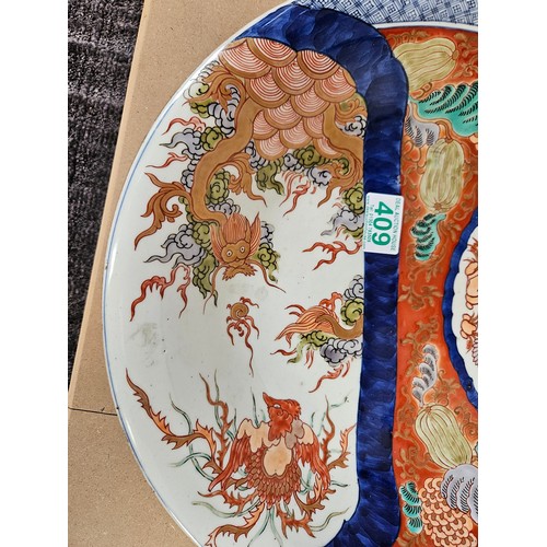 409 - Large oriental charger. Decorated to front and back 

37cm across