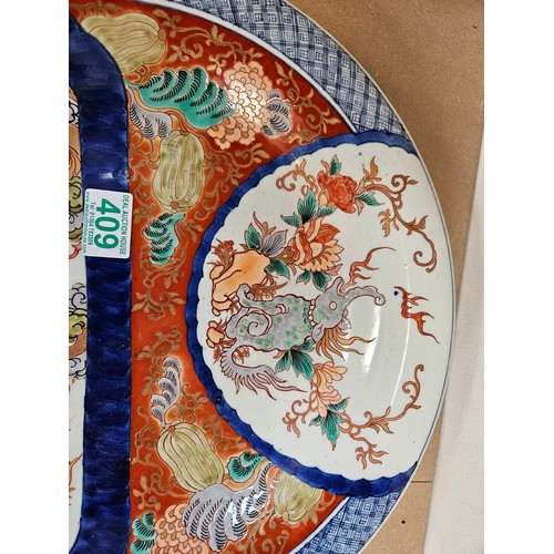 409 - Large oriental charger. Decorated to front and back 

37cm across