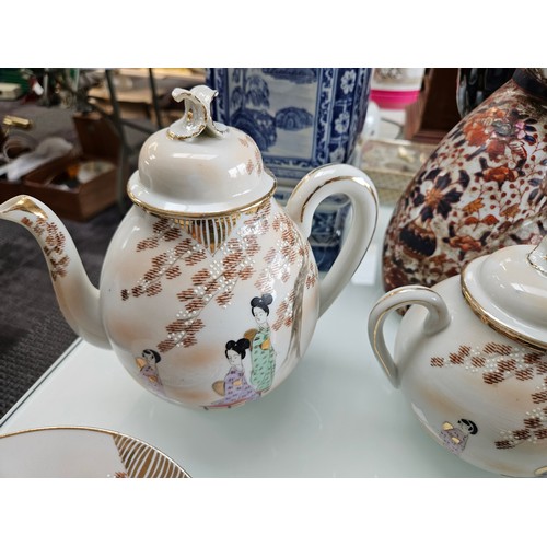 433 - Oriental tea set with jug, cups, saucers, side plates + sugar bowls