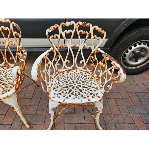 1 - Antique pair of cast iron garden armchairs. Very heavy