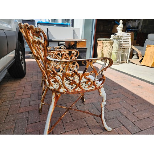 1 - Antique pair of cast iron garden armchairs. Very heavy