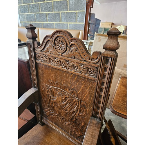 21 - Ornately carved oak Wainscot carvery chair. Carved with dragon in shield.