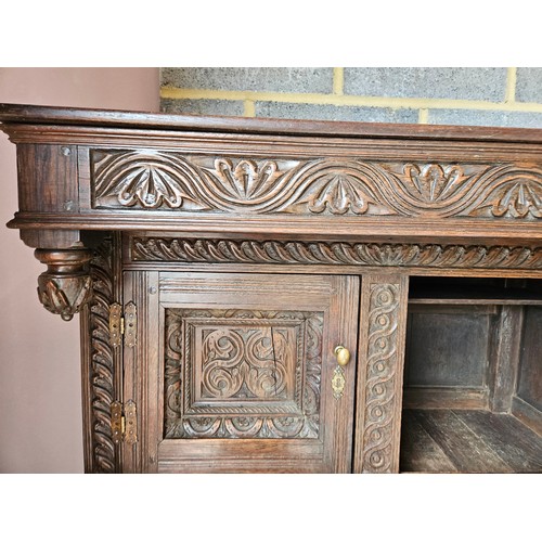 22 - Antique deeply carved oak court cupboard. Splits in two pieces.