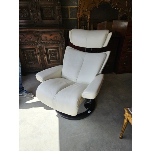 25 - Ekornes Stressless magic leather swivel and recline armchair. Very comfortable