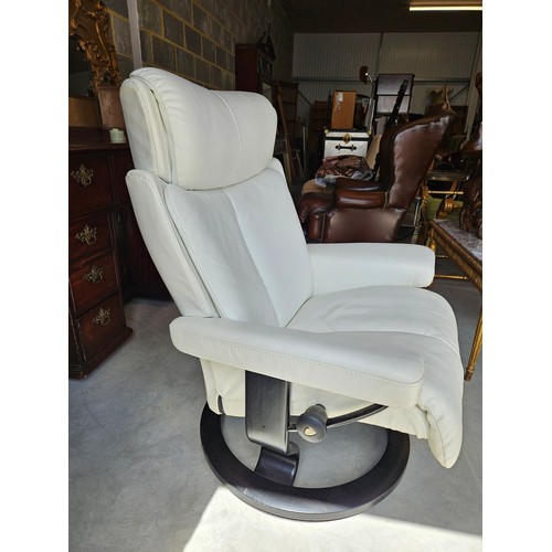 25 - Ekornes Stressless magic leather swivel and recline armchair. Very comfortable