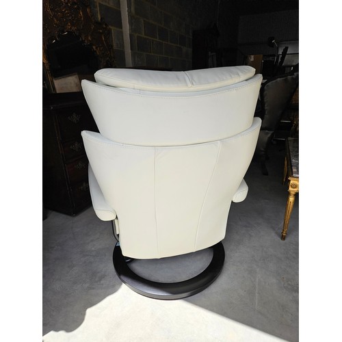 25 - Ekornes Stressless magic leather swivel and recline armchair. Very comfortable