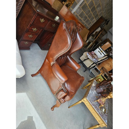 26 - Chesterfield Armchair, button back leather with cabriole legs