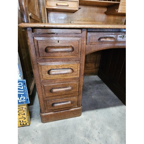 41 - Antique oak 1920's roll top desk. With fitted interior with smaller drawers. The desk breaks down fo... 