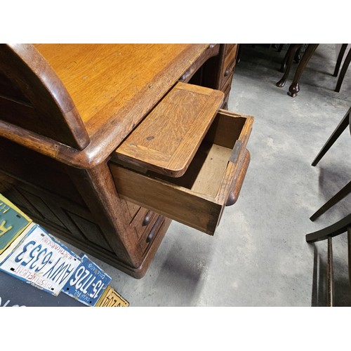 41 - Antique oak 1920's roll top desk. With fitted interior with smaller drawers. The desk breaks down fo... 