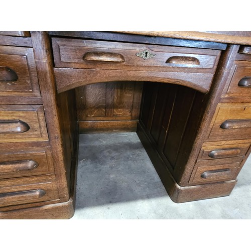 41 - Antique oak 1920's roll top desk. With fitted interior with smaller drawers. The desk breaks down fo... 