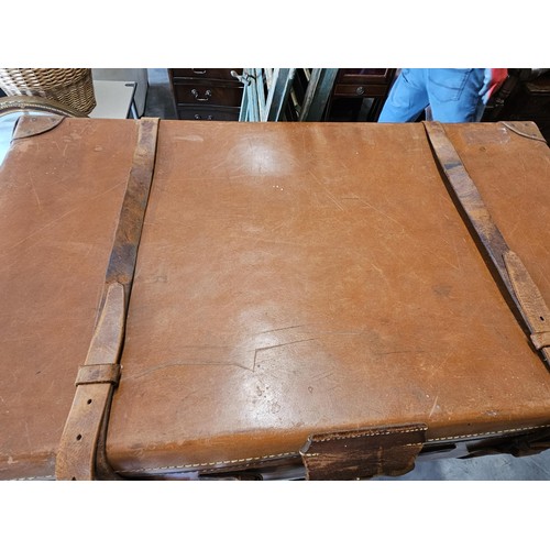 45 - Large suitcase. With straps and buckles