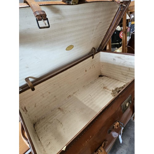 45 - Large suitcase. With straps and buckles