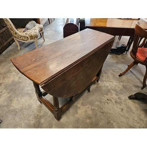 15 - Antique oak drop leaf table