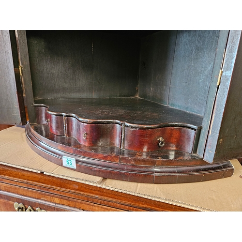 63 - Antique mahogany Georgian corner cupboard with H hinges and scalloped shelves.