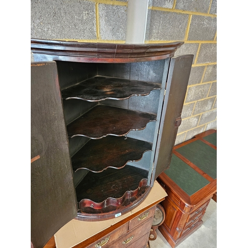 63 - Antique mahogany Georgian corner cupboard with H hinges and scalloped shelves.