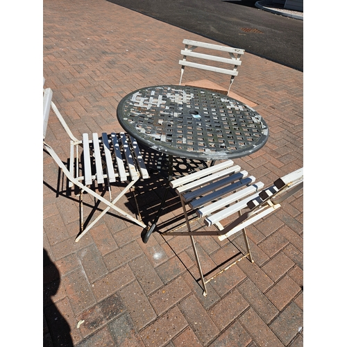 71 - Metal garden table and three white folding wooden/ metal chairs