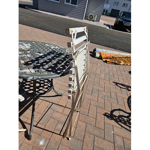 71 - Metal garden table and three white folding wooden/ metal chairs