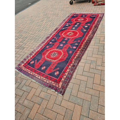 119 - Large antique Aztec design rug

135cm x 336cm