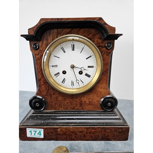 174 - Burr veneer mantel clock, with enamel face and beveled glass.
With pendulum