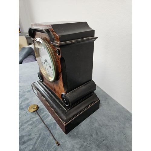 174 - Burr veneer mantel clock, with enamel face and beveled glass.
With pendulum