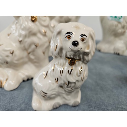 225 - 6 x graduated size Beswick Staffordshire flatback style dogs. 
Pair of large, medium and small dogs.... 