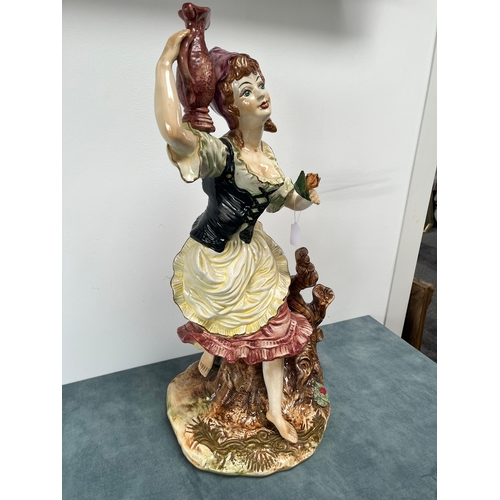 247 - Large Capodimonte ornament of lady 

Chipping to flower 

67cm high x 32cm wide