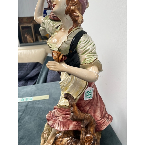 247 - Large Capodimonte ornament of lady 

Chipping to flower 

67cm high x 32cm wide