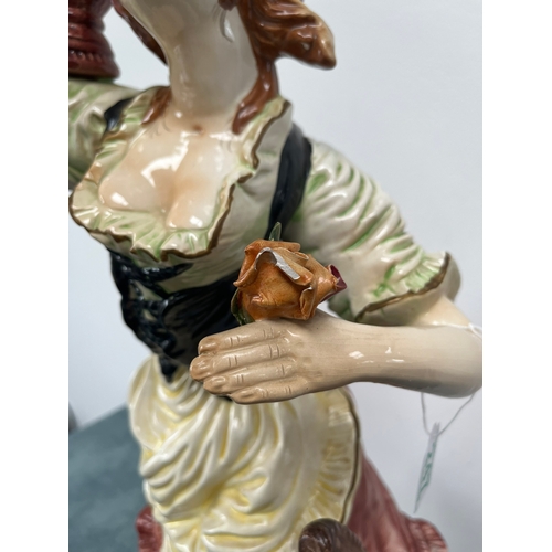 247 - Large Capodimonte ornament of lady 

Chipping to flower 

67cm high x 32cm wide