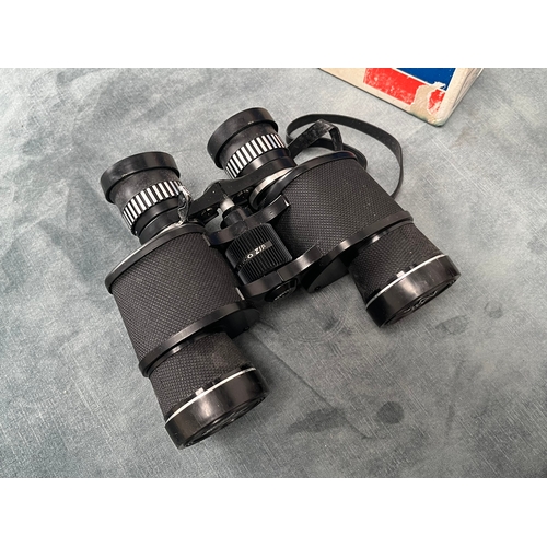 251 - Pair of Tasco binoculars 
8x - 16x40