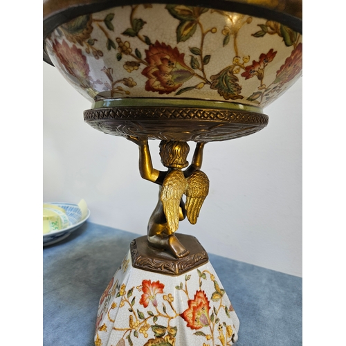 302 - Gilded bronze and porcelain cherub bowl