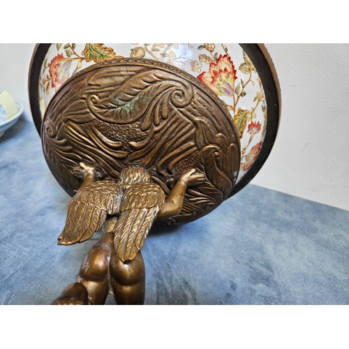 302 - Gilded bronze and porcelain cherub bowl