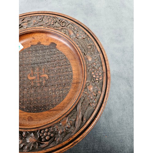 468 - Antique carved wood collection plate.  High quality carvings
29cm across