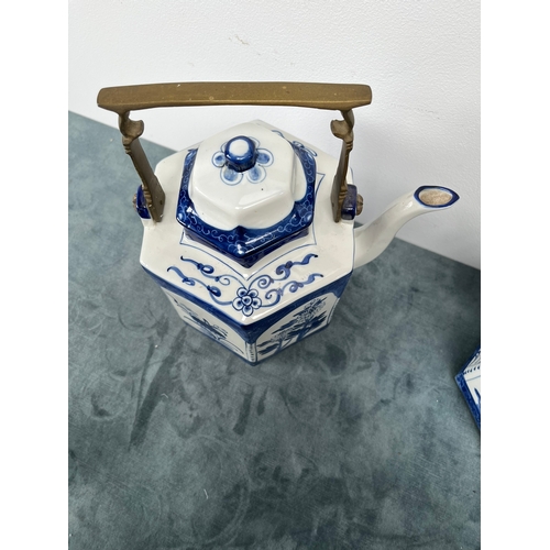 538 - Pair of large oriental blue and white teapots