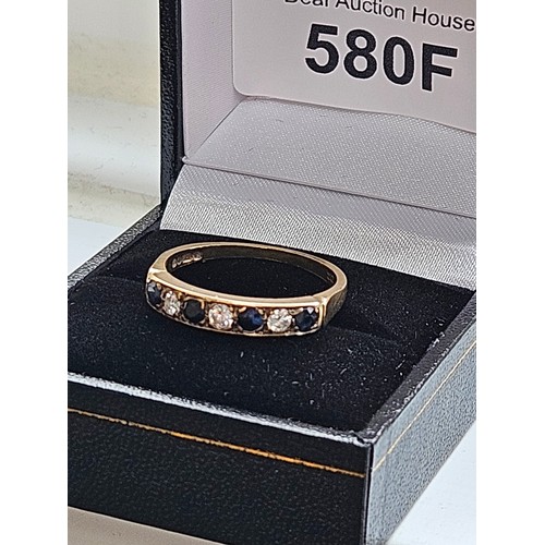 580F - 9ct yellow gold.
Diamond and sapphire half eternity ring.
2.7g