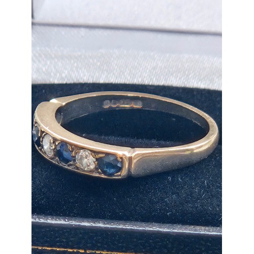 580F - 9ct yellow gold.
Diamond and sapphire half eternity ring.
2.7g