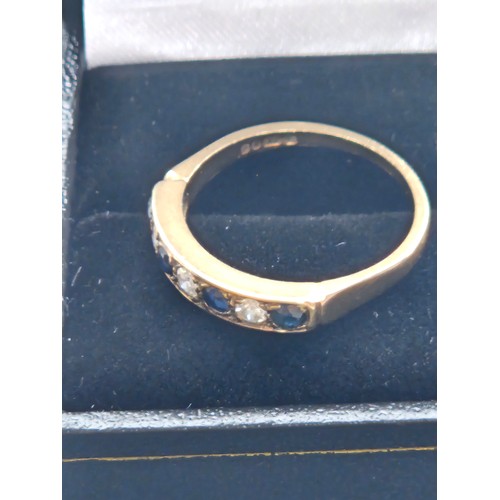 580F - 9ct yellow gold.
Diamond and sapphire half eternity ring.
2.7g