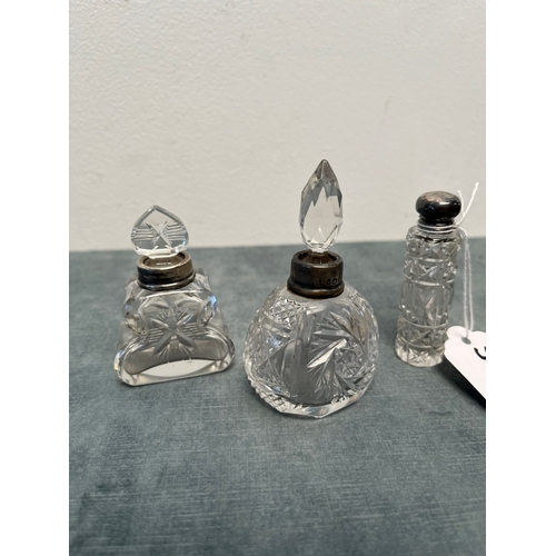 581A - 3 x cut crystal and silver rimmed bottles